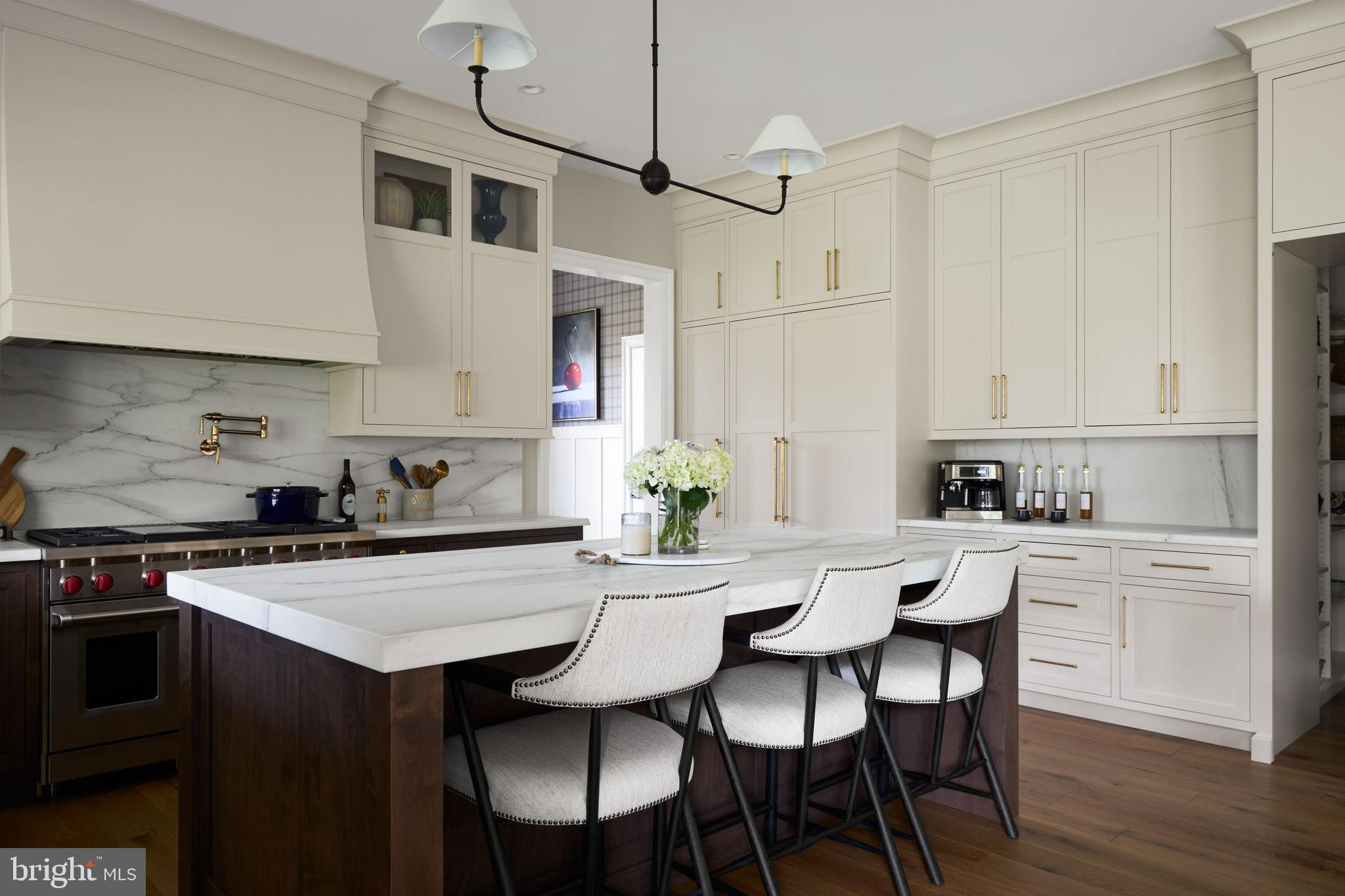 474 Barclay Road Bryn Mawr, PA 19010 - Photo 7 of 15 a kitchen with stainless steel appliances a table and chairs in it