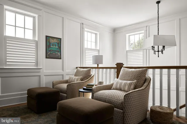 a living room with furniture and windows