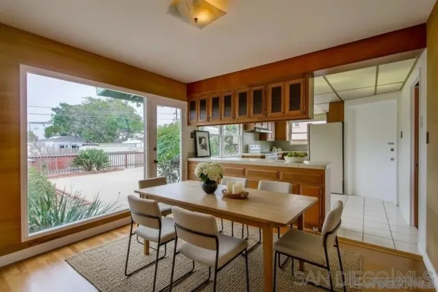 a dining room with furniture window and outside view