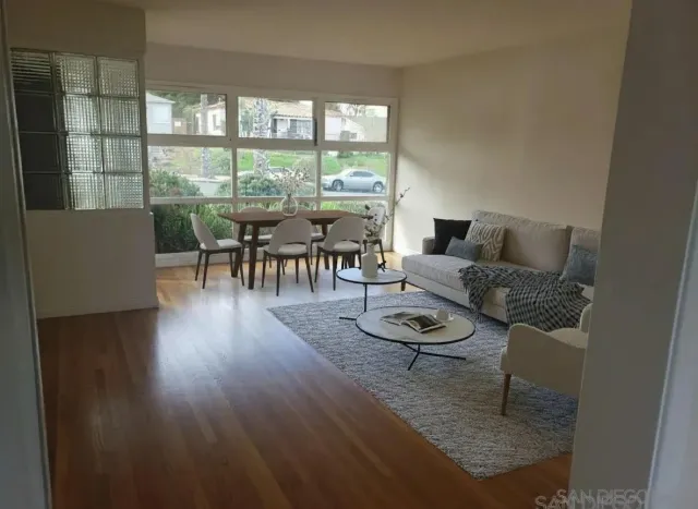 a living room with furniture and a table