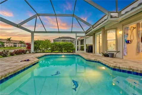 a view of a swimming pool with a patio