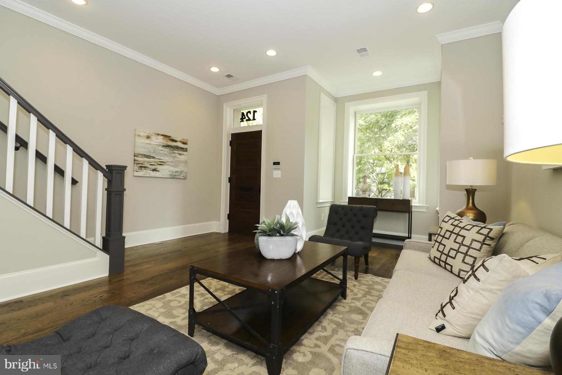 124 11th Street Northeast Washington, DC 20002 - Photo 4 of 30 a living room with furniture and wooden floor