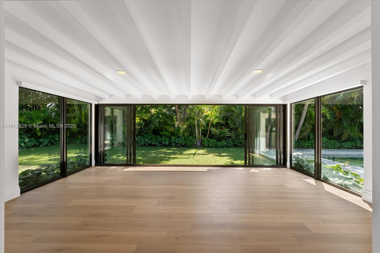 325 Gulf Road Key Biscayne, FL 33149 - Photo 16 of 51 a house with yard in front of it