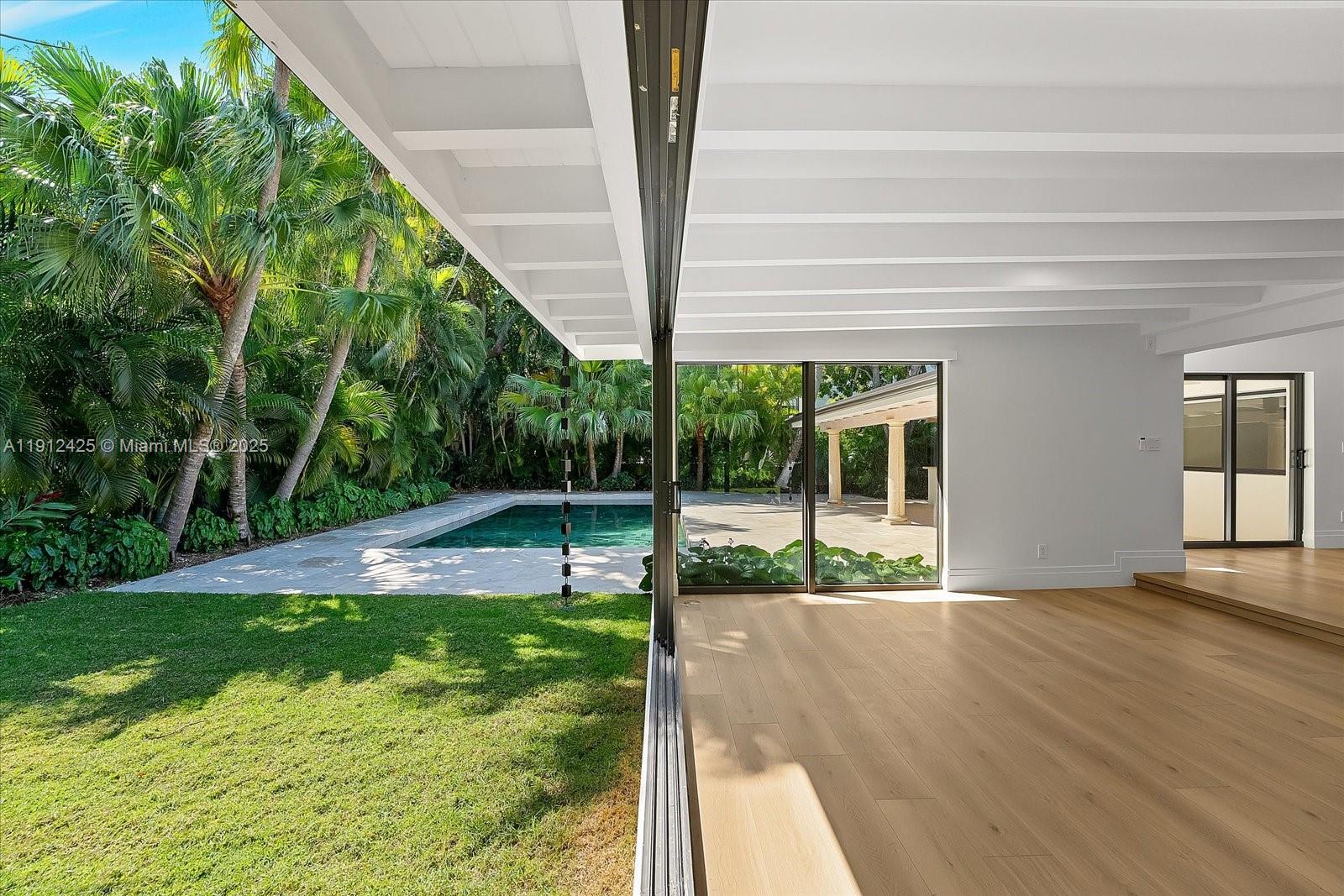 325 Gulf Road Key Biscayne, FL 33149 - Photo 18 of 51 a view of a house with backyard and porch