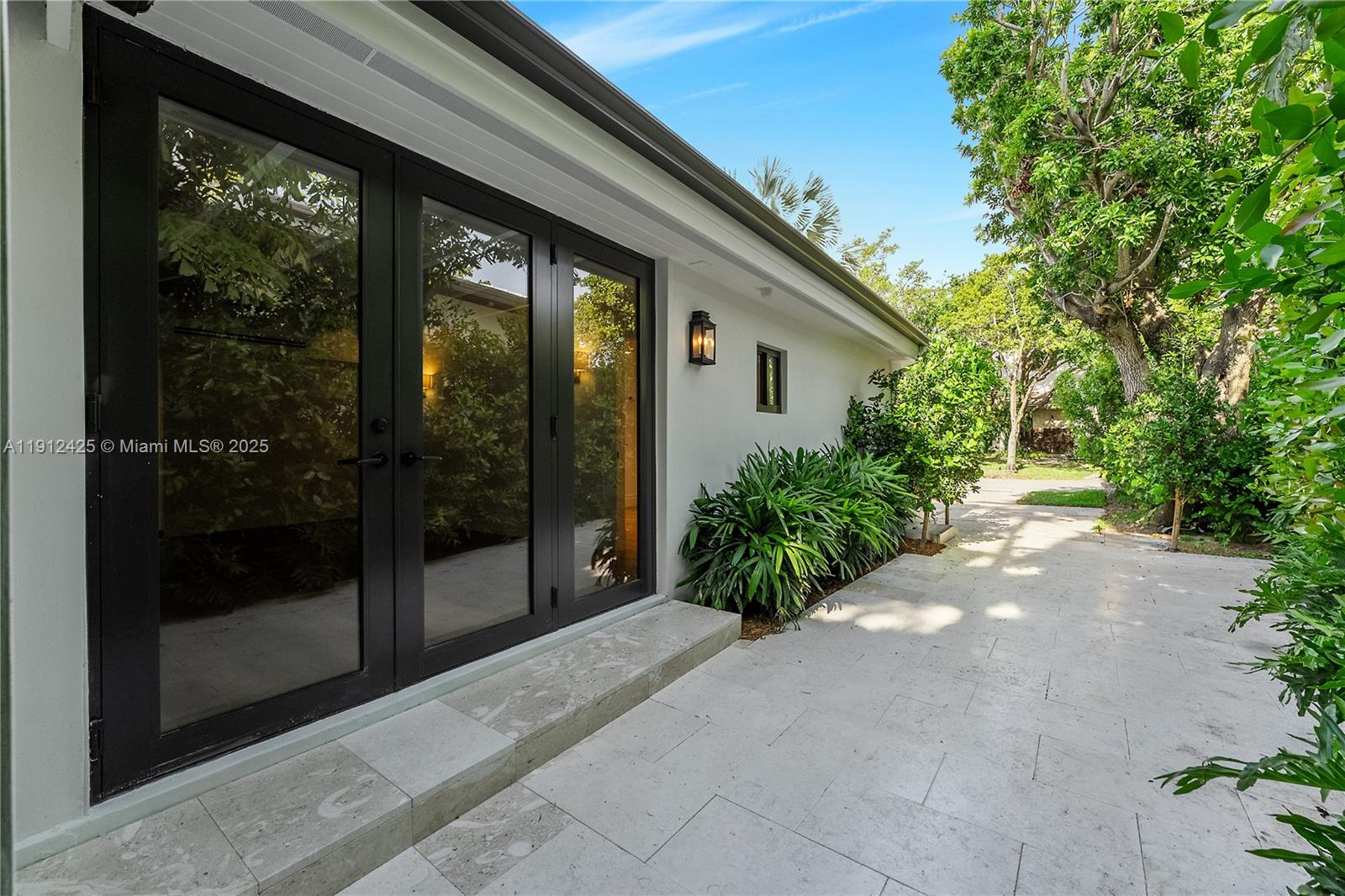 325 Gulf Road Key Biscayne, FL 33149 - Photo 21 of 51 a view of backyard with green space