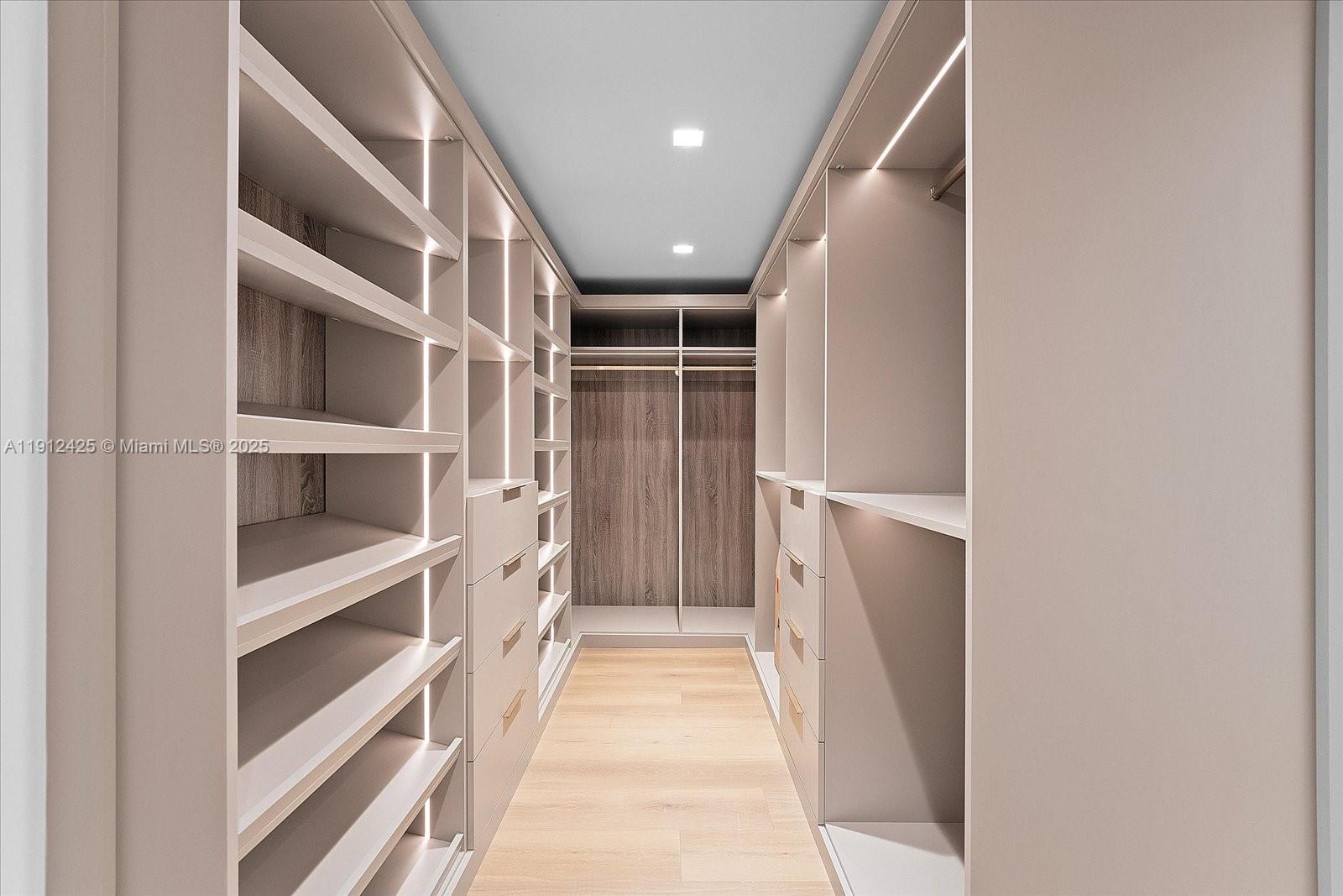 325 Gulf Road Key Biscayne, FL 33149 - Photo 24 of 51 a view of walk in closet with empty racks