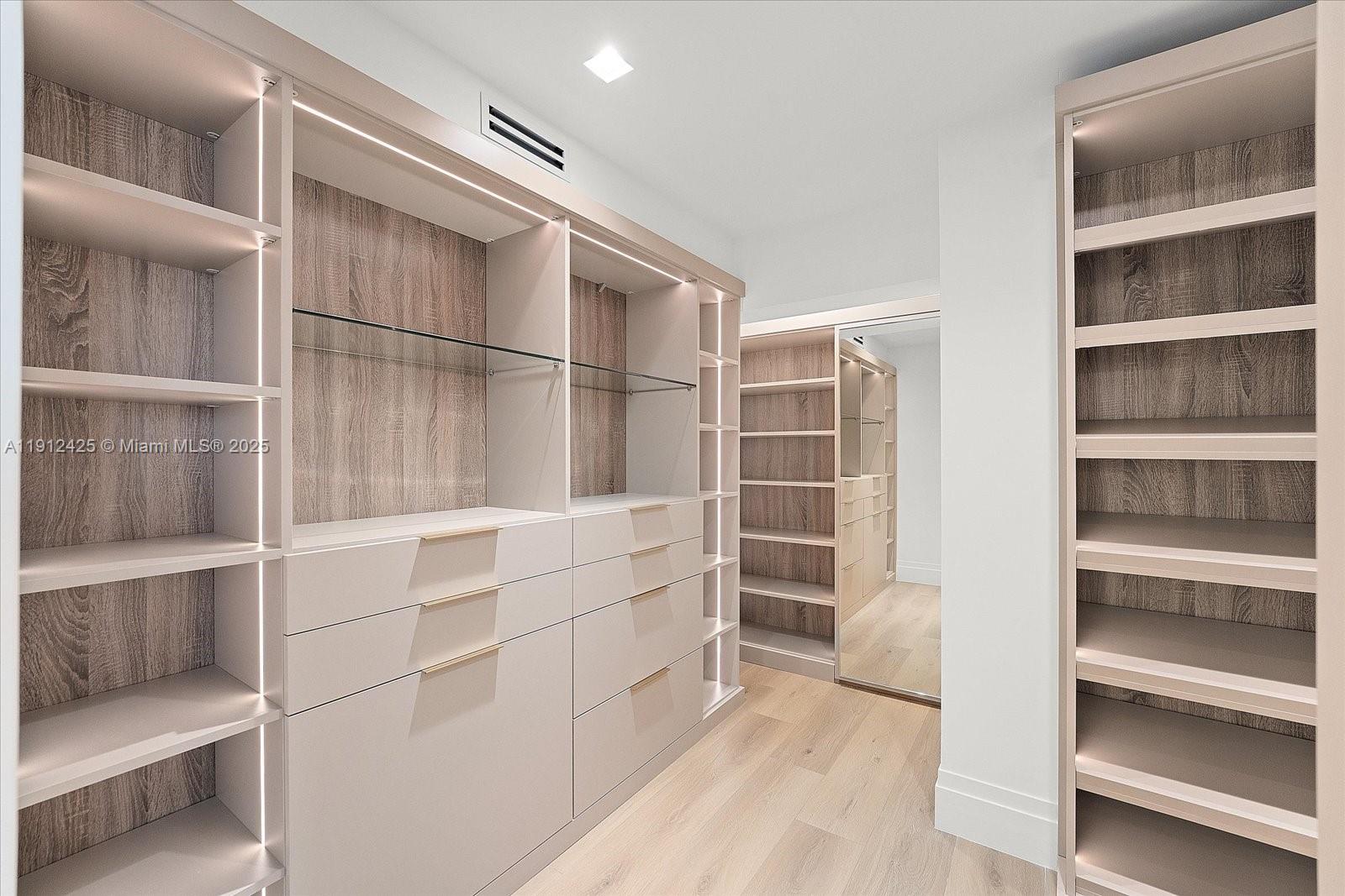 325 Gulf Road Key Biscayne, FL 33149 - Photo 25 of 51 a view of closet area with empty racks