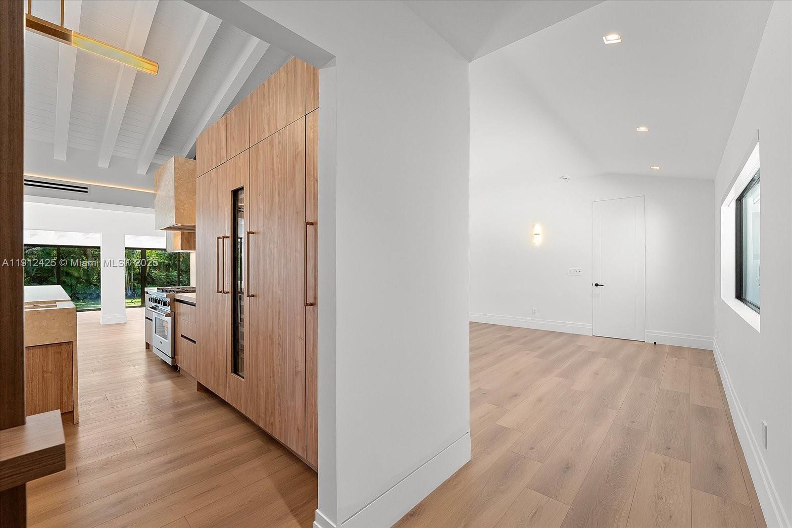 325 Gulf Road Key Biscayne, FL 33149 - Photo 3 of 51 wooden floor in an empty room with a window