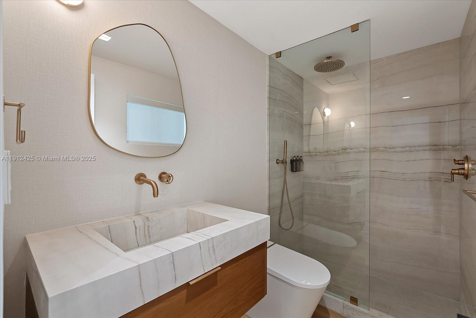 325 Gulf Road Key Biscayne, FL 33149 - Photo 37 of 51 a bathroom with a sink a toilet and shower