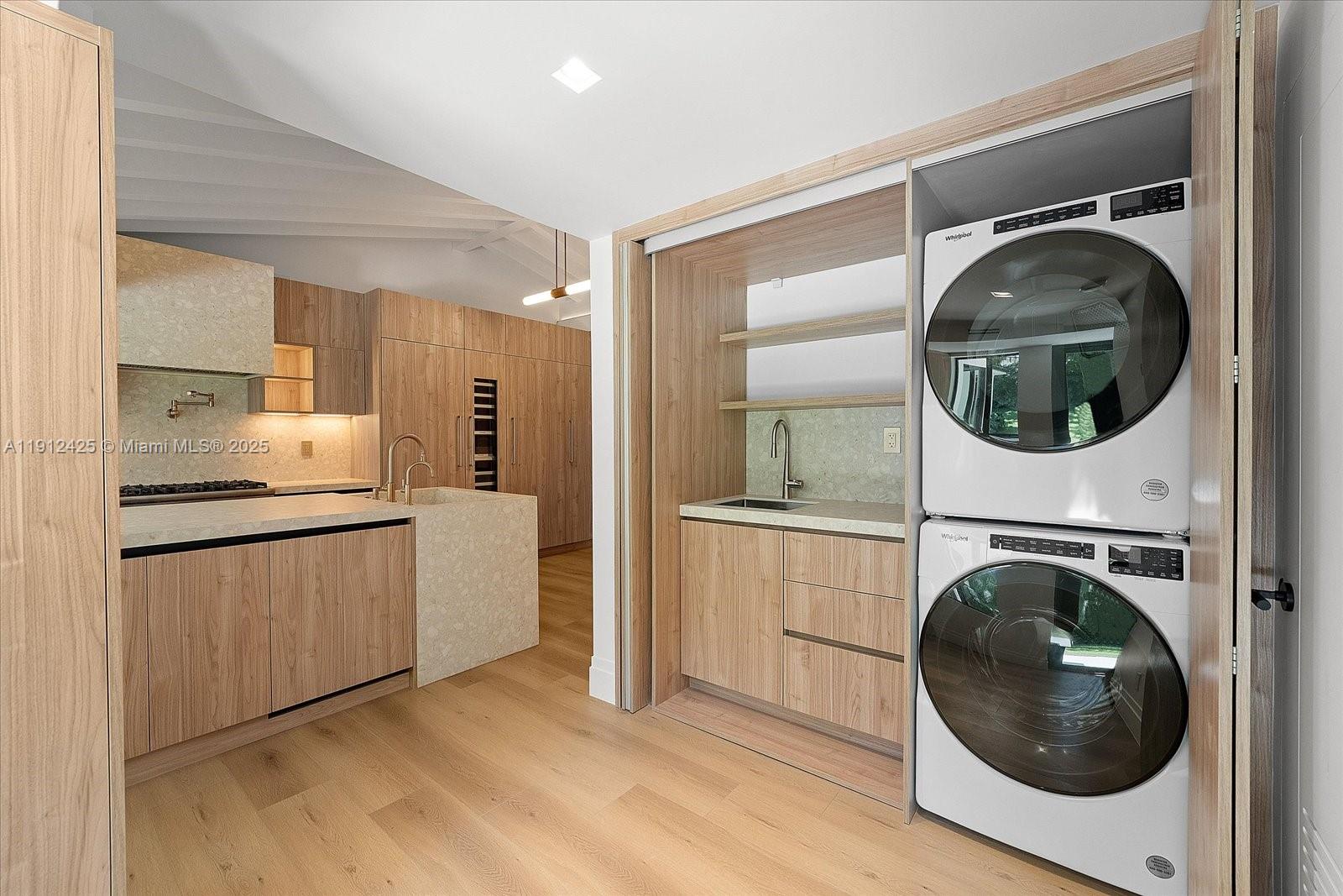 325 Gulf Road Key Biscayne, FL 33149 - Photo 38 of 51 a kitchen with a washer and dryer in it