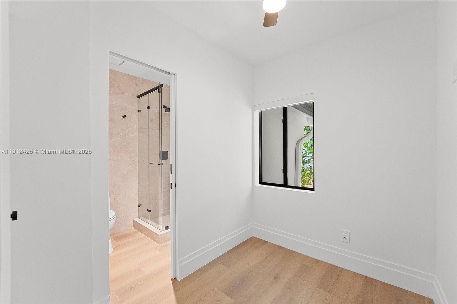 325 Gulf Road Key Biscayne, FL 33149 - Photo 39 of 51 an empty room with windows and closet