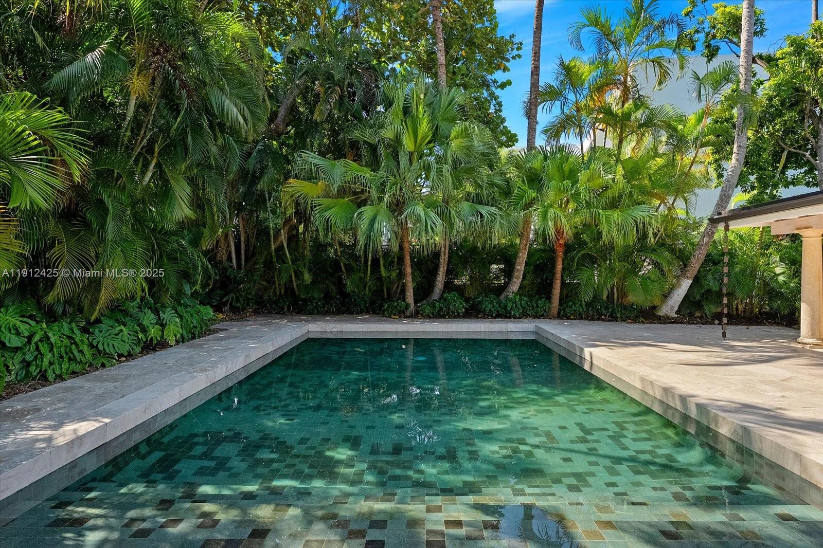 325 Gulf Road Key Biscayne, FL 33149 - Photo 42 of 51 a view of a backyard with a trees