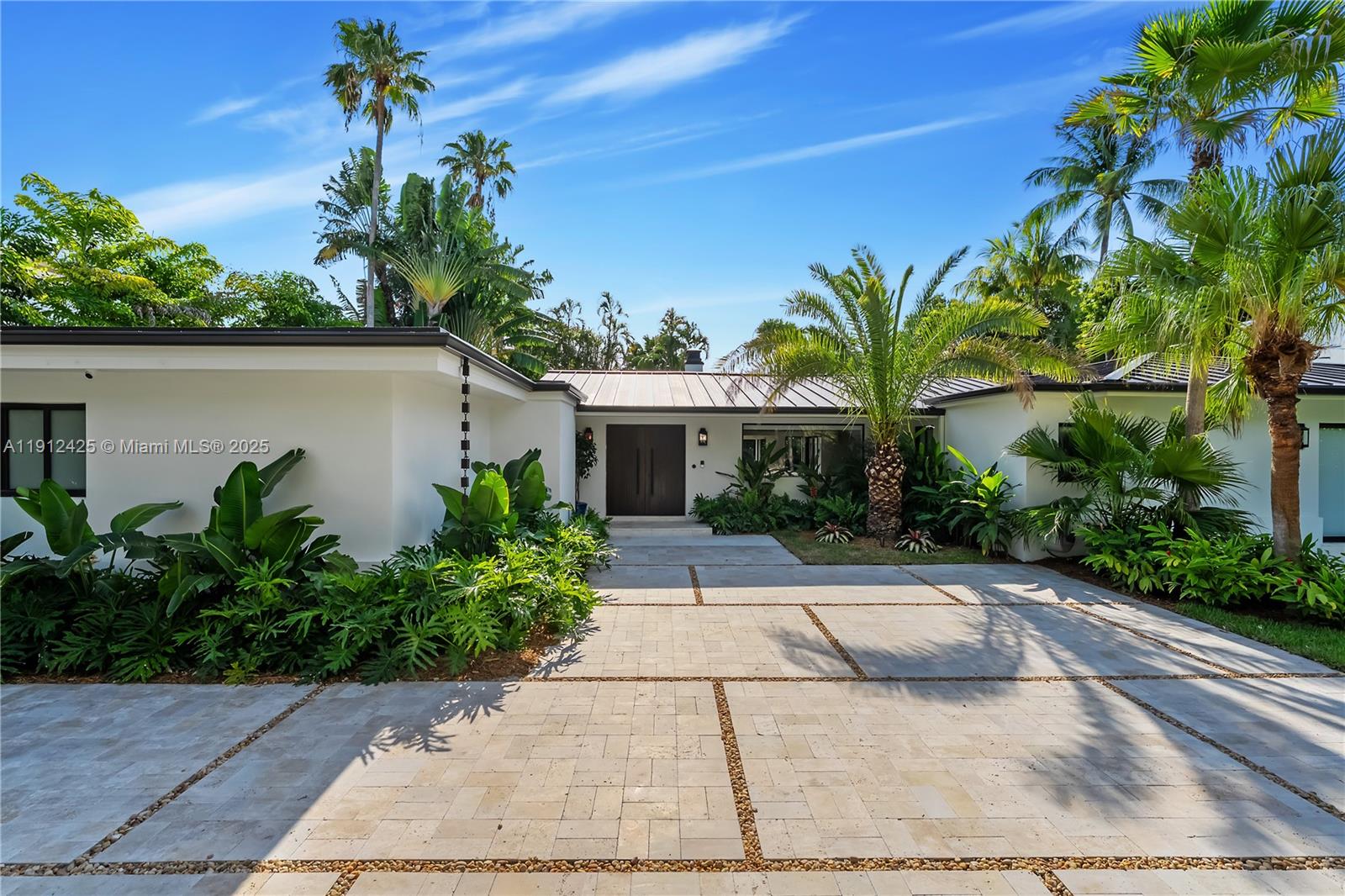 325 Gulf Road Key Biscayne, FL 33149 - Photo 45 of 51 front view of a house with a yard