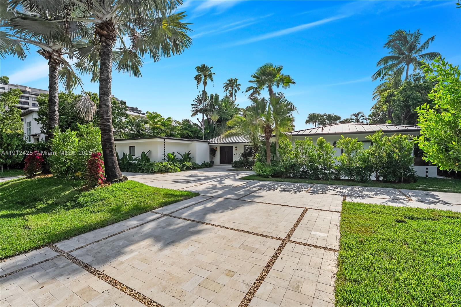 325 Gulf Road Key Biscayne, FL 33149 - Photo 46 of 51 a view of a backyard with a garden