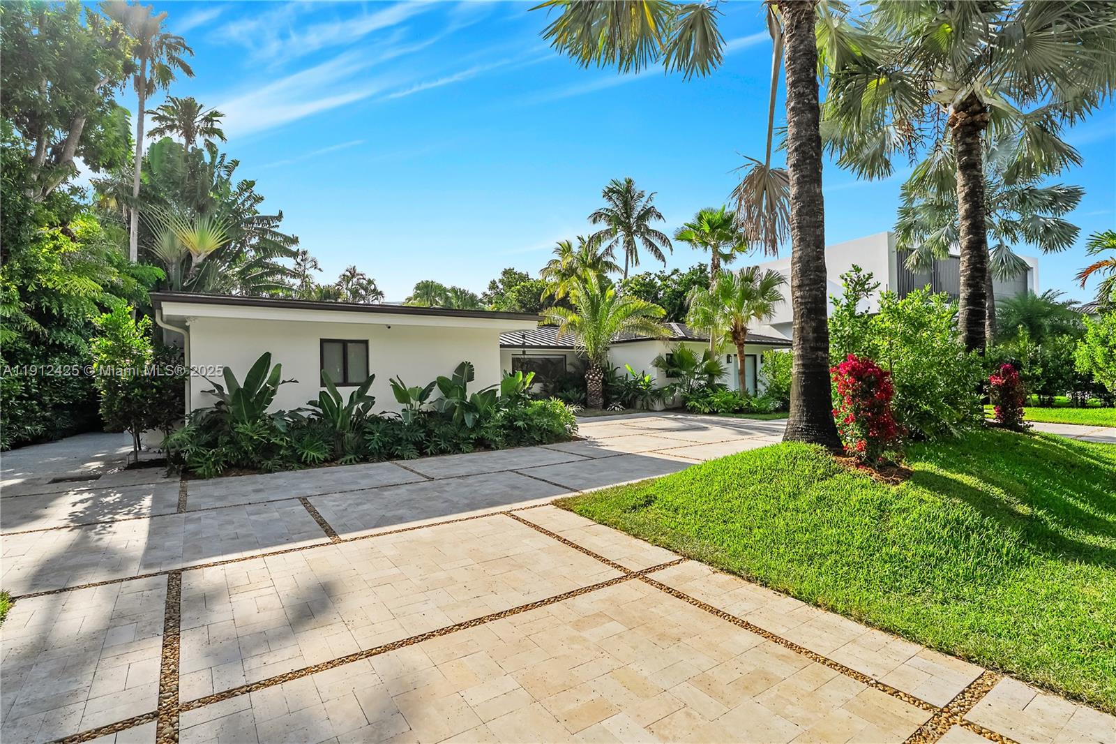 325 Gulf Road Key Biscayne, FL 33149 - Photo 47 of 51 a view of backyard with a garden and palm trees