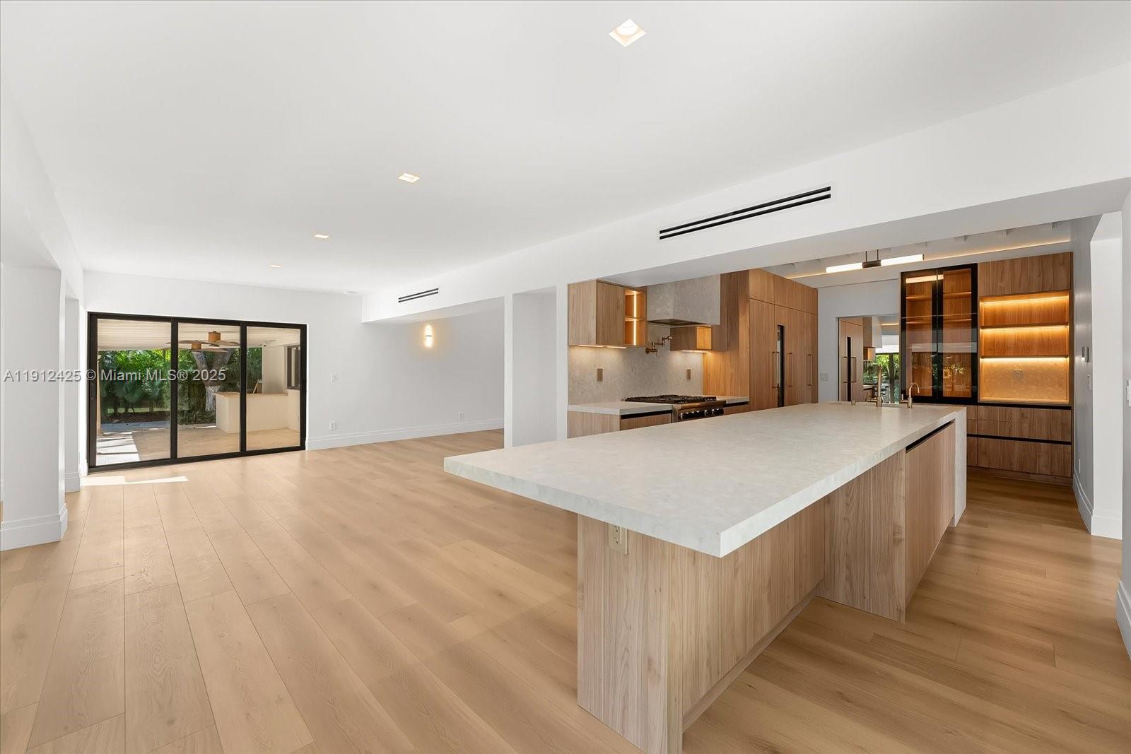325 Gulf Road Key Biscayne, FL 33149 - Photo 8 of 51 a view of kitchen with cabinets and wooden floor