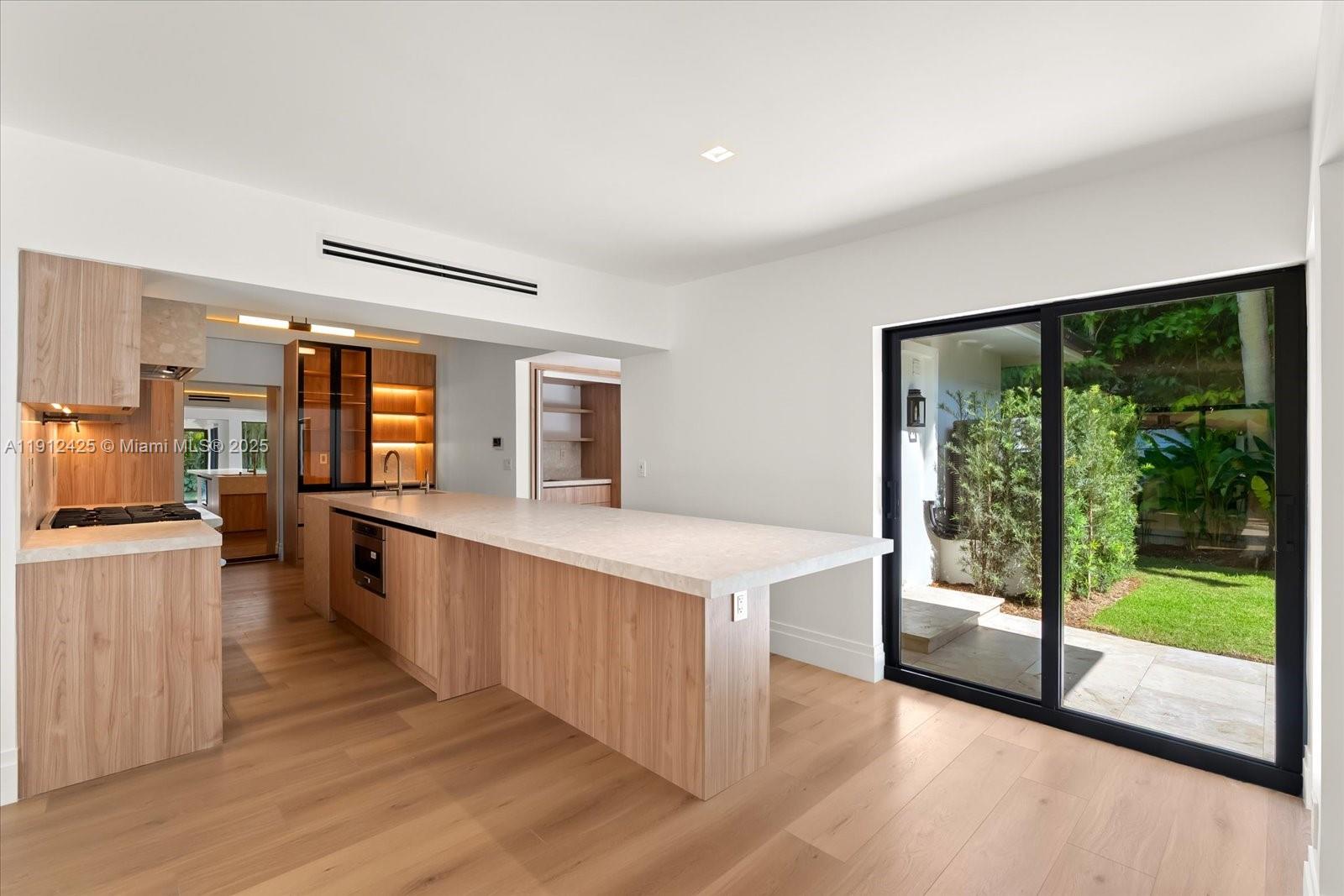 325 Gulf Road Key Biscayne, FL 33149 - Photo 9 of 51 a large living room with a large window