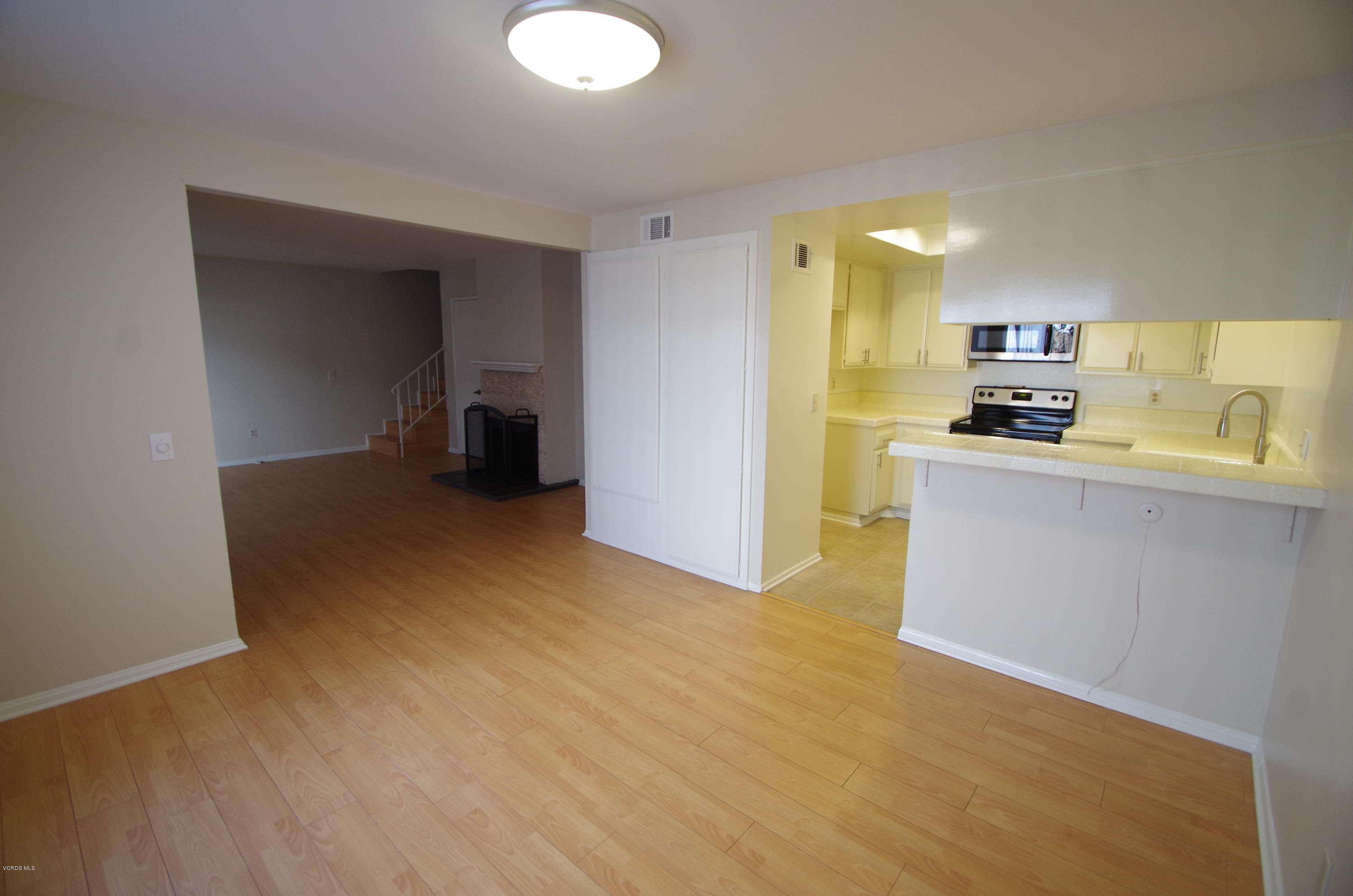 533 Spring Road, Unit 22 Moorpark, CA 93021 - Photo 5 of 20 a kitchen with granite countertop a sink and a stove top oven