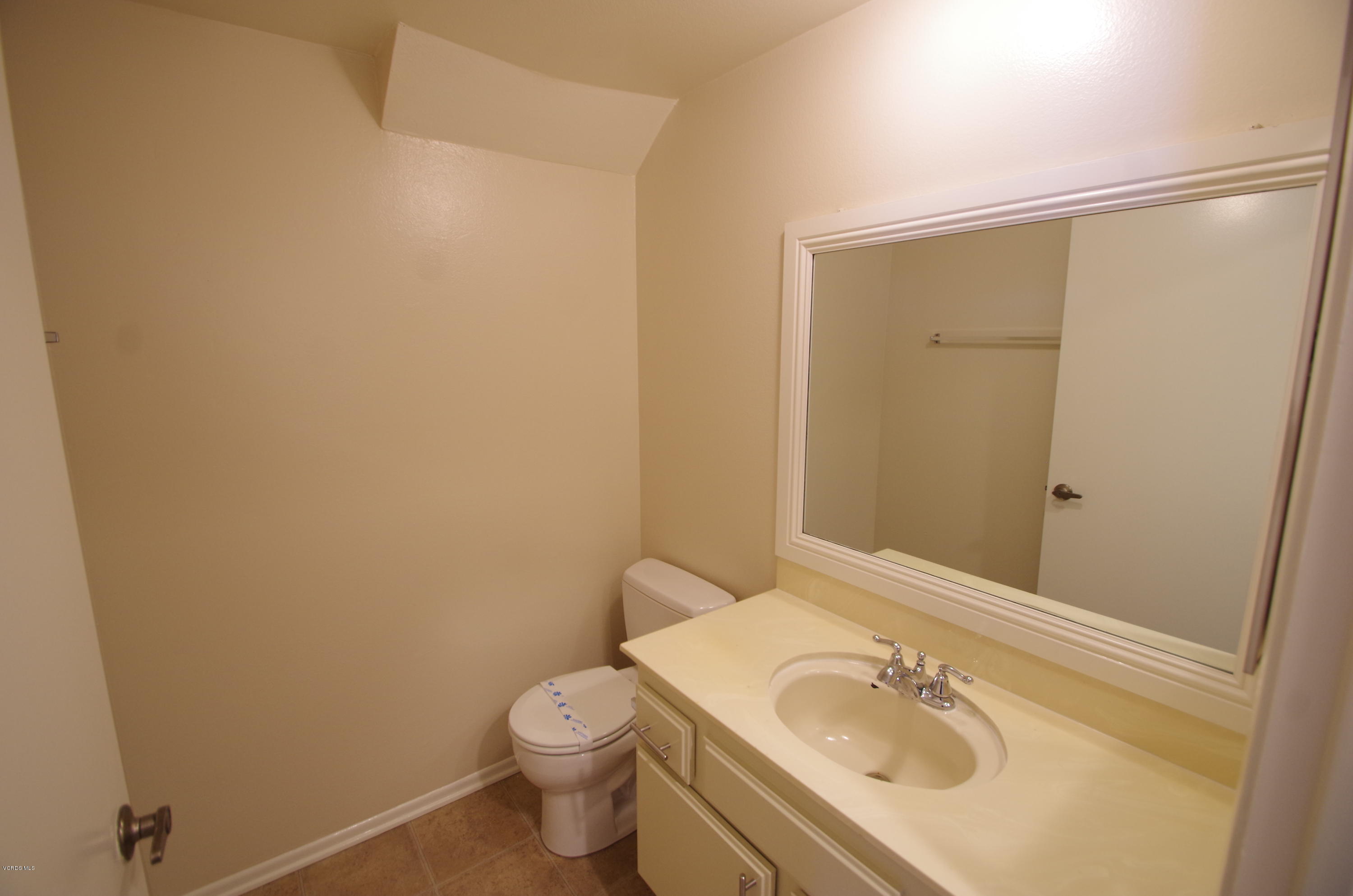 533 Spring Road, Unit 22 Moorpark, CA 93021 - Photo 8 of 20 a bathroom with a sink a toilet and shower