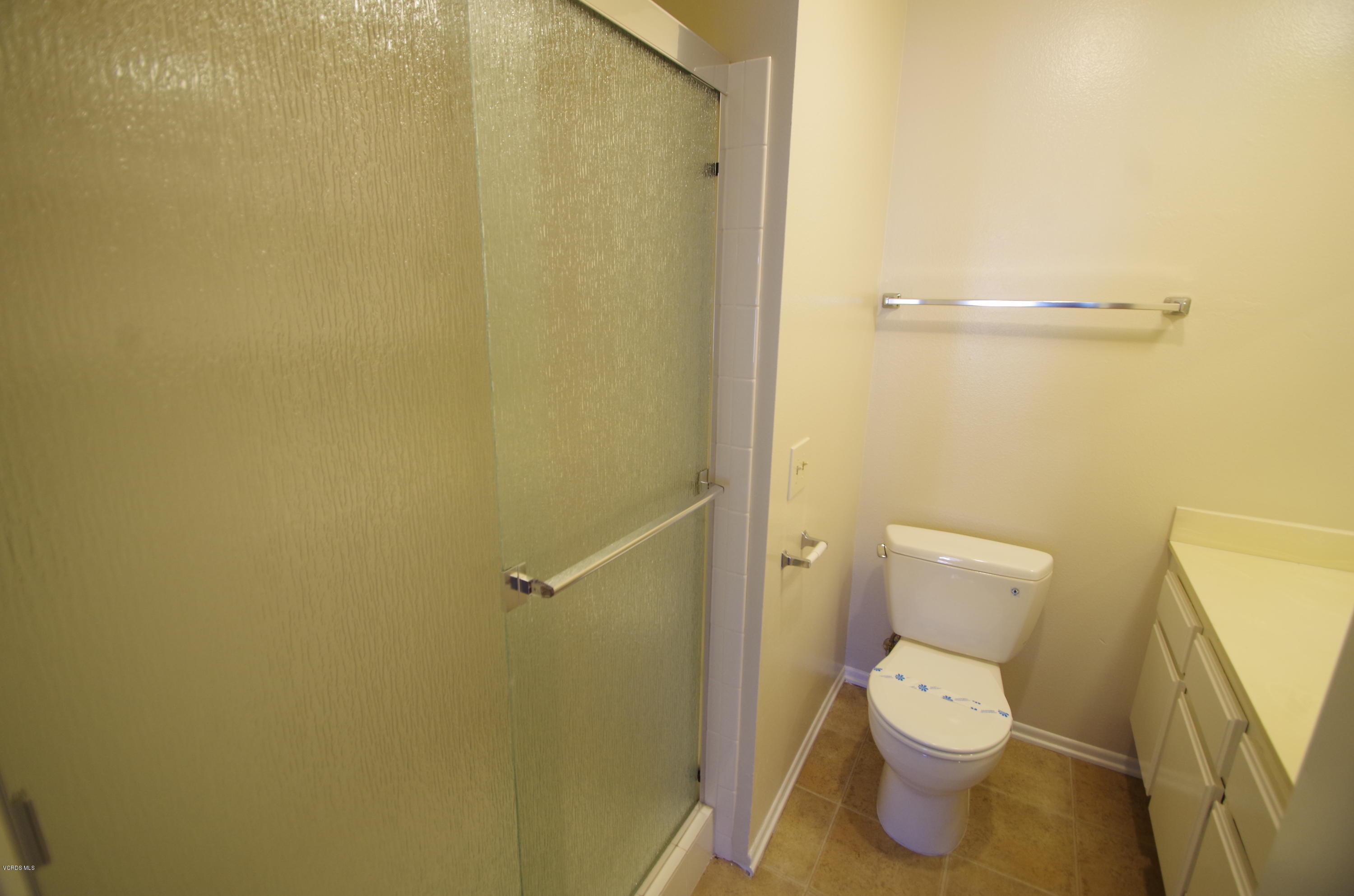 533 Spring Road, Unit 22 Moorpark, CA 93021 - Photo 10 of 20 a white toilet sitting next to a small sink