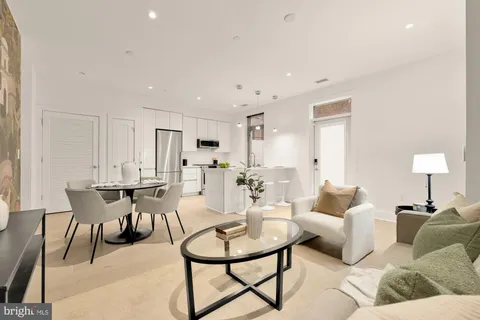 a living room with furniture and a table