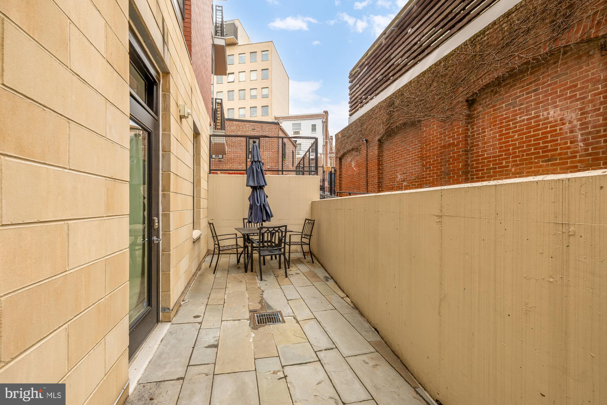 1745 N Street Northwest, Unit 104 Washington, DC 20036 - Photo 18 of 28 a view of balcony with chairs