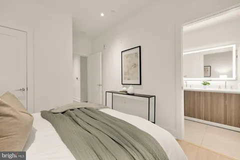 a bedroom with a bed and a dresser