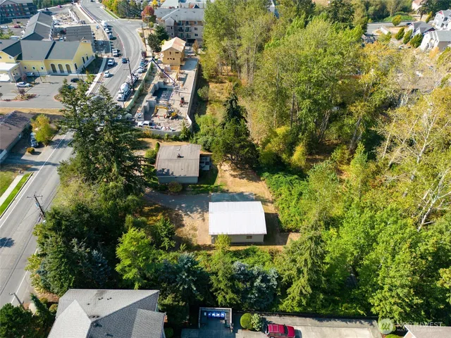 an aerial view of a house with a yard