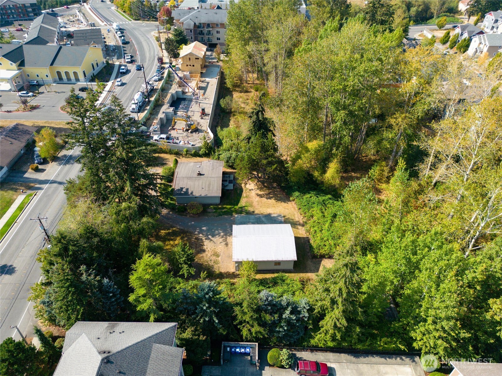 an aerial view of a house with a yard