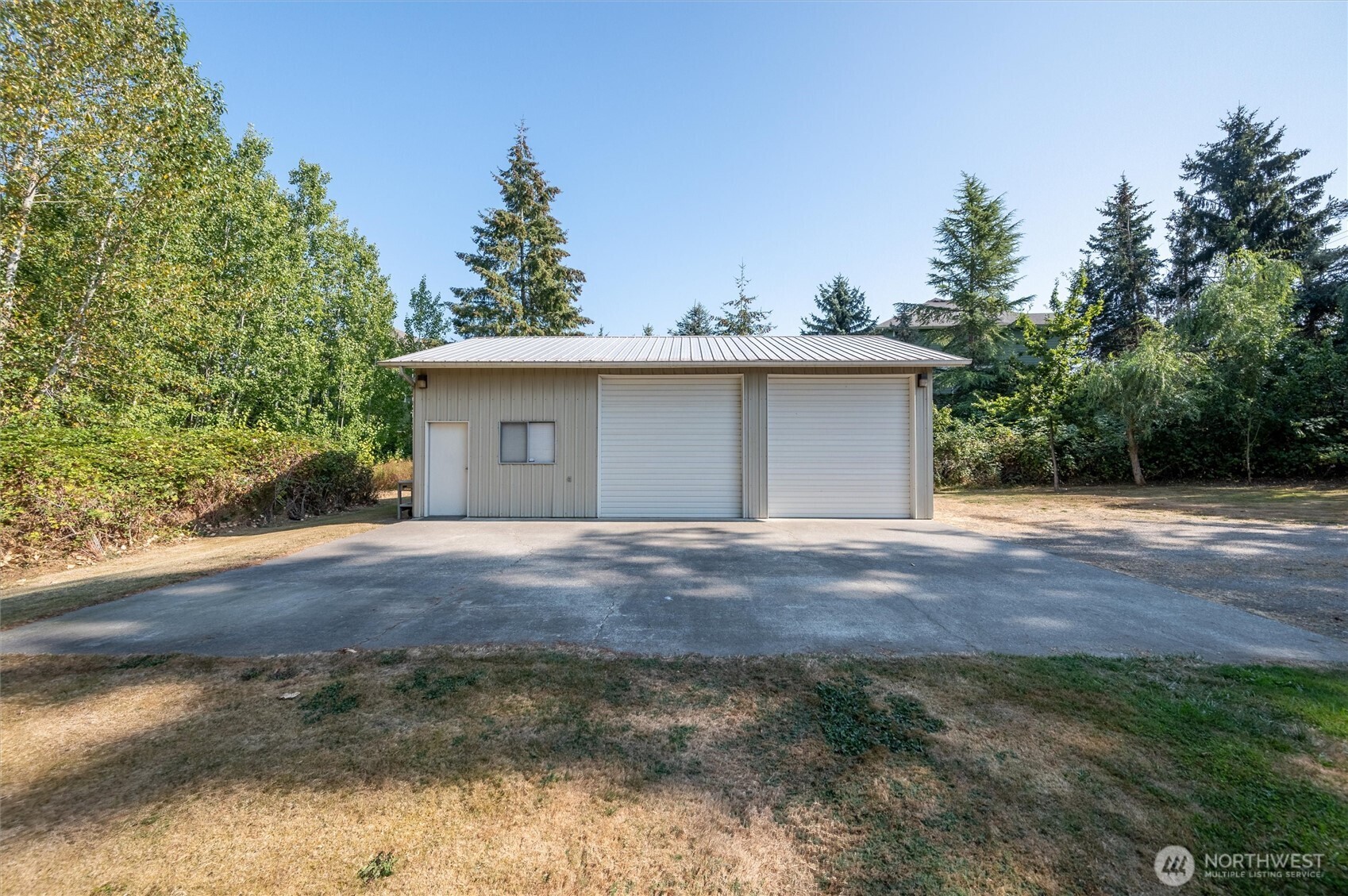 620 Telegraph Road Bellingham, WA 98226 - Photo 9 of 21 a view of a house with a yard and garage