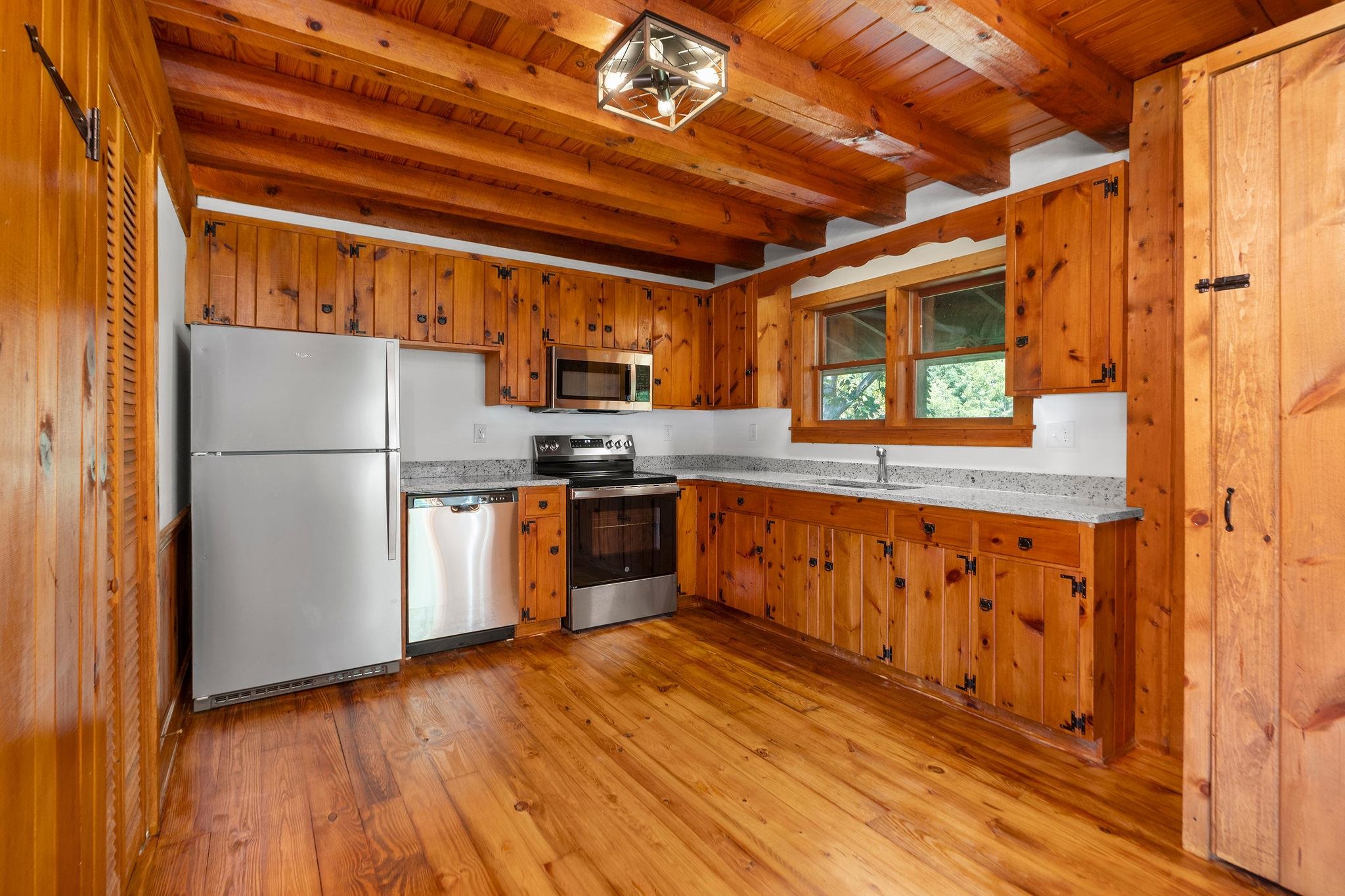188 River Rdg Road Verona, VA 24482 - Photo 28 of 64 a kitchen with stainless steel appliances granite countertop a refrigerator a stove top oven a sink and dishwasher