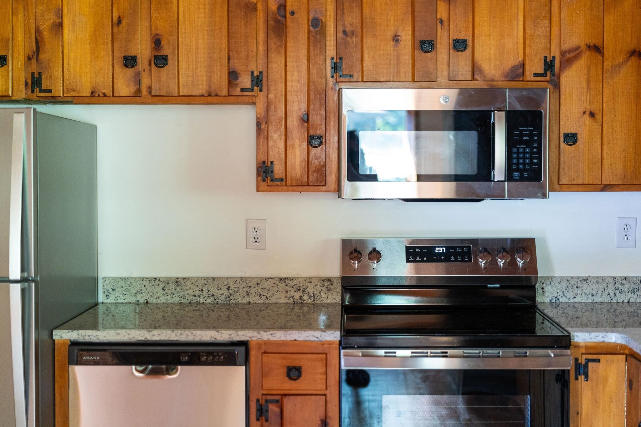 188 River Rdg Road Verona, VA 24482 - Photo 40 of 64 a kitchen with stainless steel appliances granite countertop a stove and a microwave