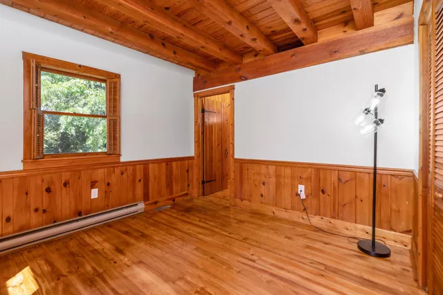 a view of a bedroom with a window