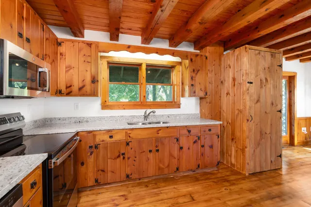 a view of a door and a window of the house