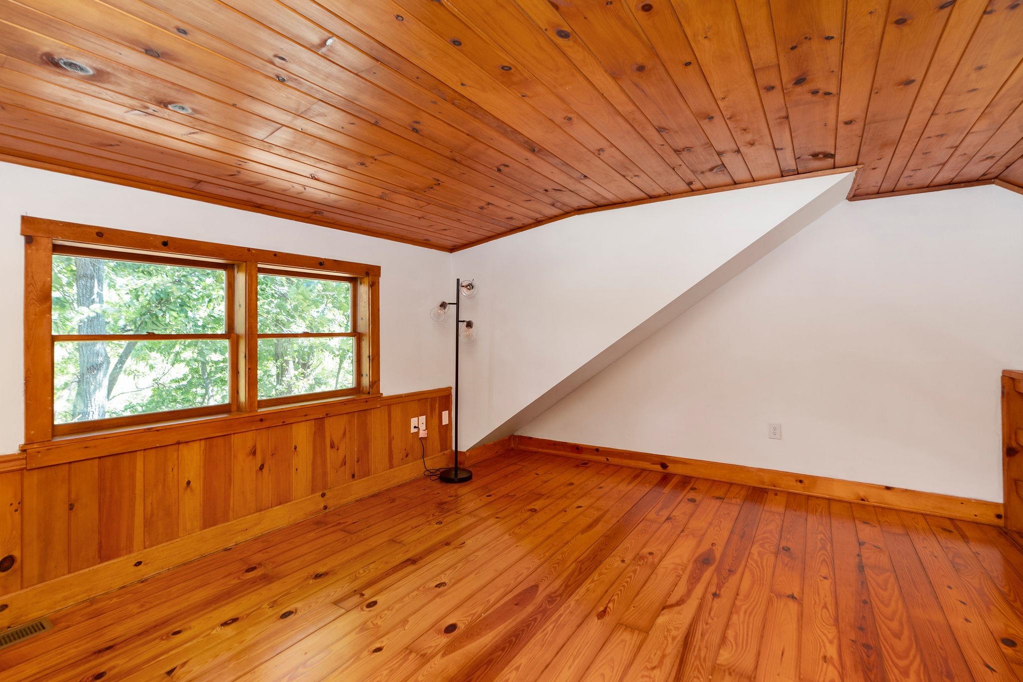 188 River Rdg Road Verona, VA 24482 - Photo 49 of 64 a view of an empty room with wooden floor and a window