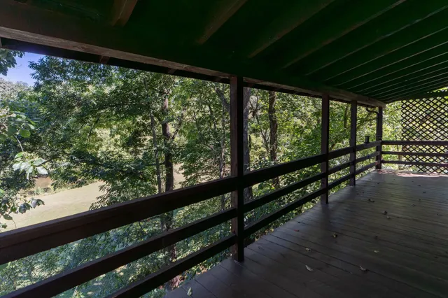 a balcony with wooden floor