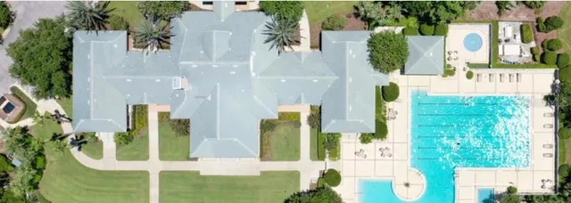 an aerial view of a house with a garden