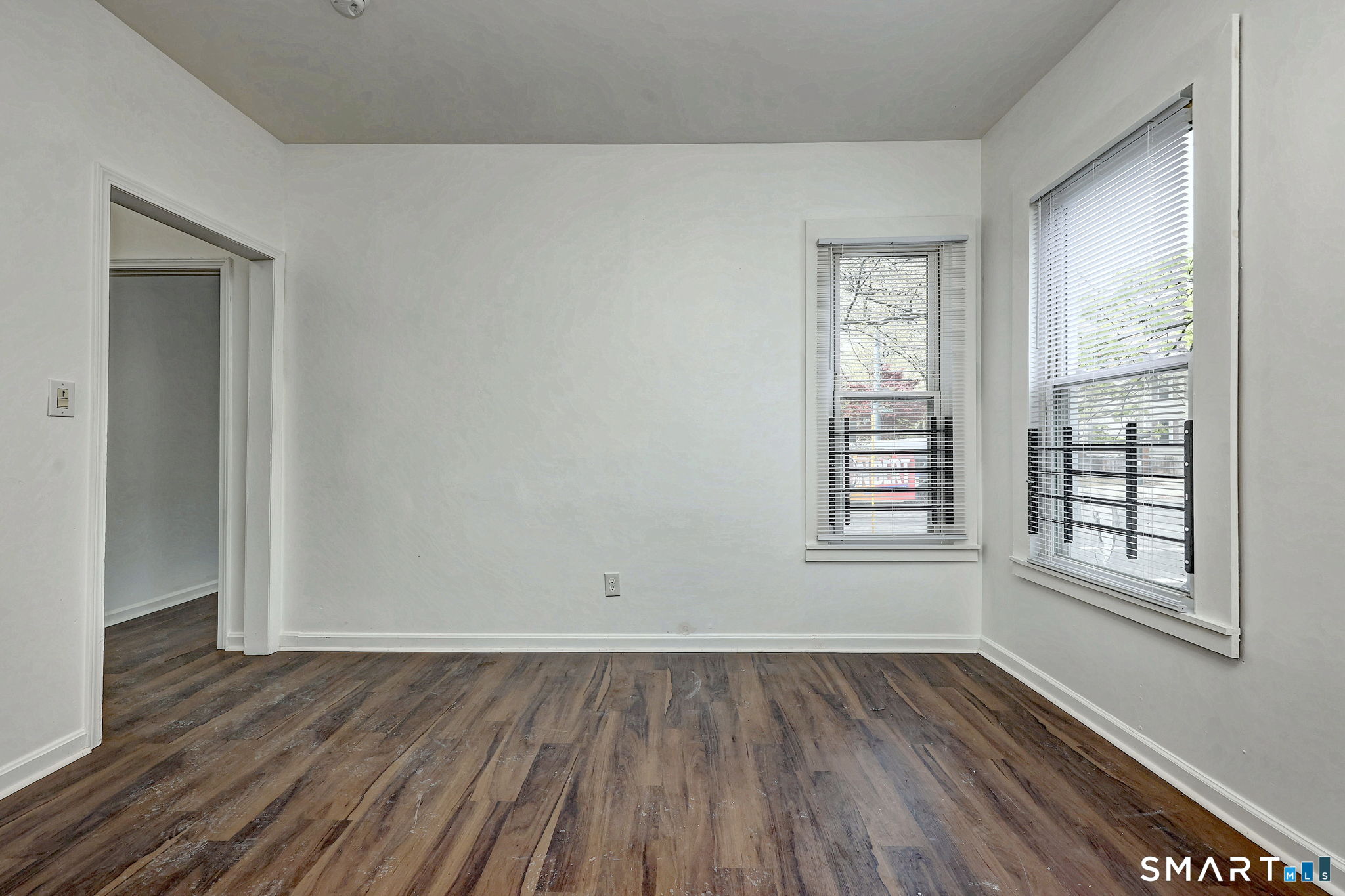 483 Ferry Street, Unit 1 New Haven, CT 06513 - Photo 12 of 33 an empty room with wooden floor and windows