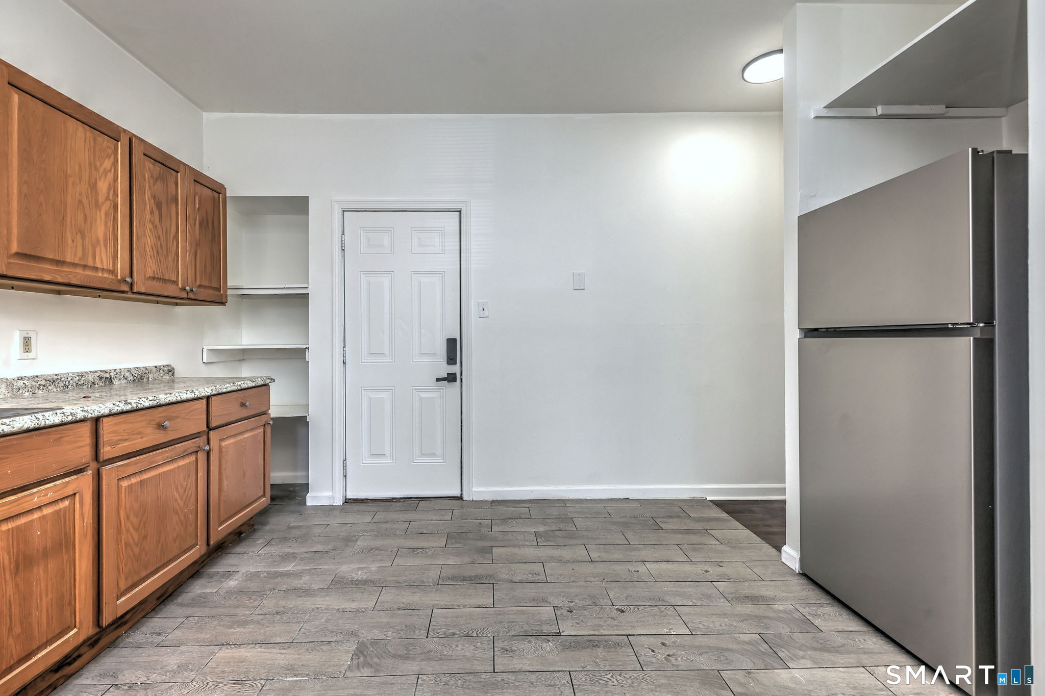 483 Ferry Street, Unit 1 New Haven, CT 06513 - Photo 17 of 33 a kitchen with a refrigerator and a sink
