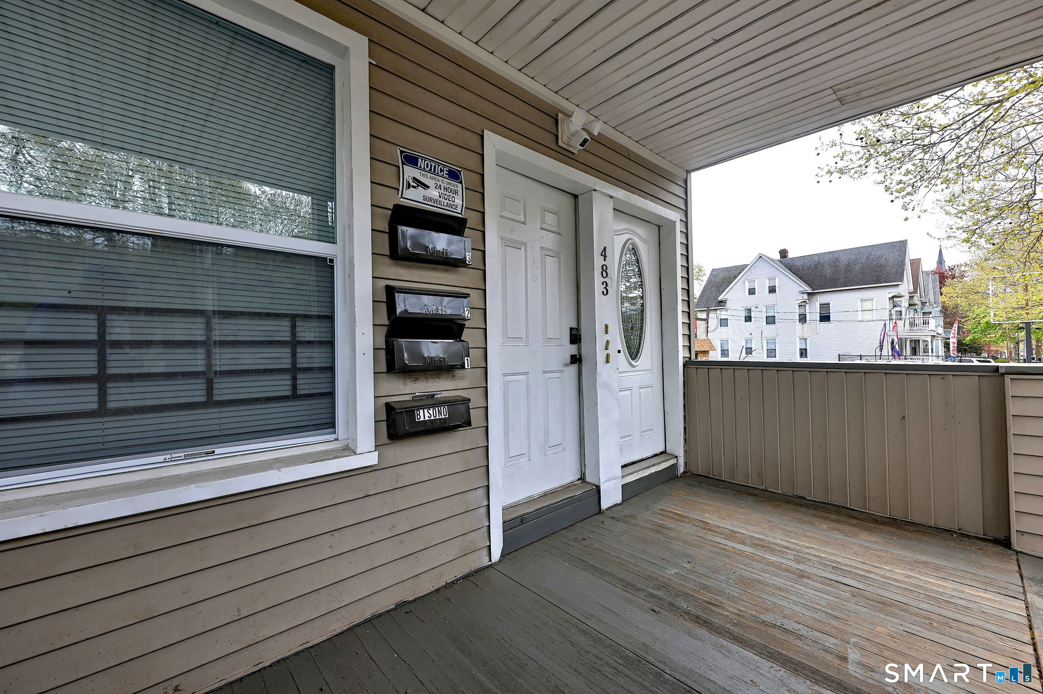 483 Ferry Street, Unit 1 New Haven, CT 06513 - Photo 2 of 33 a view of a porch with wooden floor and windows