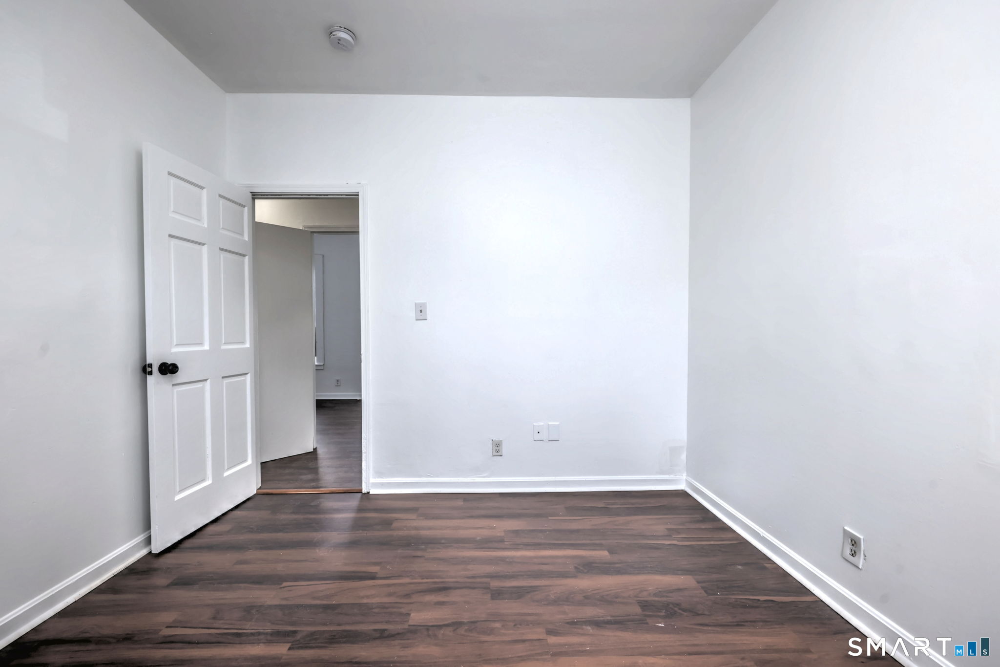 483 Ferry Street, Unit 1 New Haven, CT 06513 - Photo 23 of 33 a view of an empty room with wooden floor