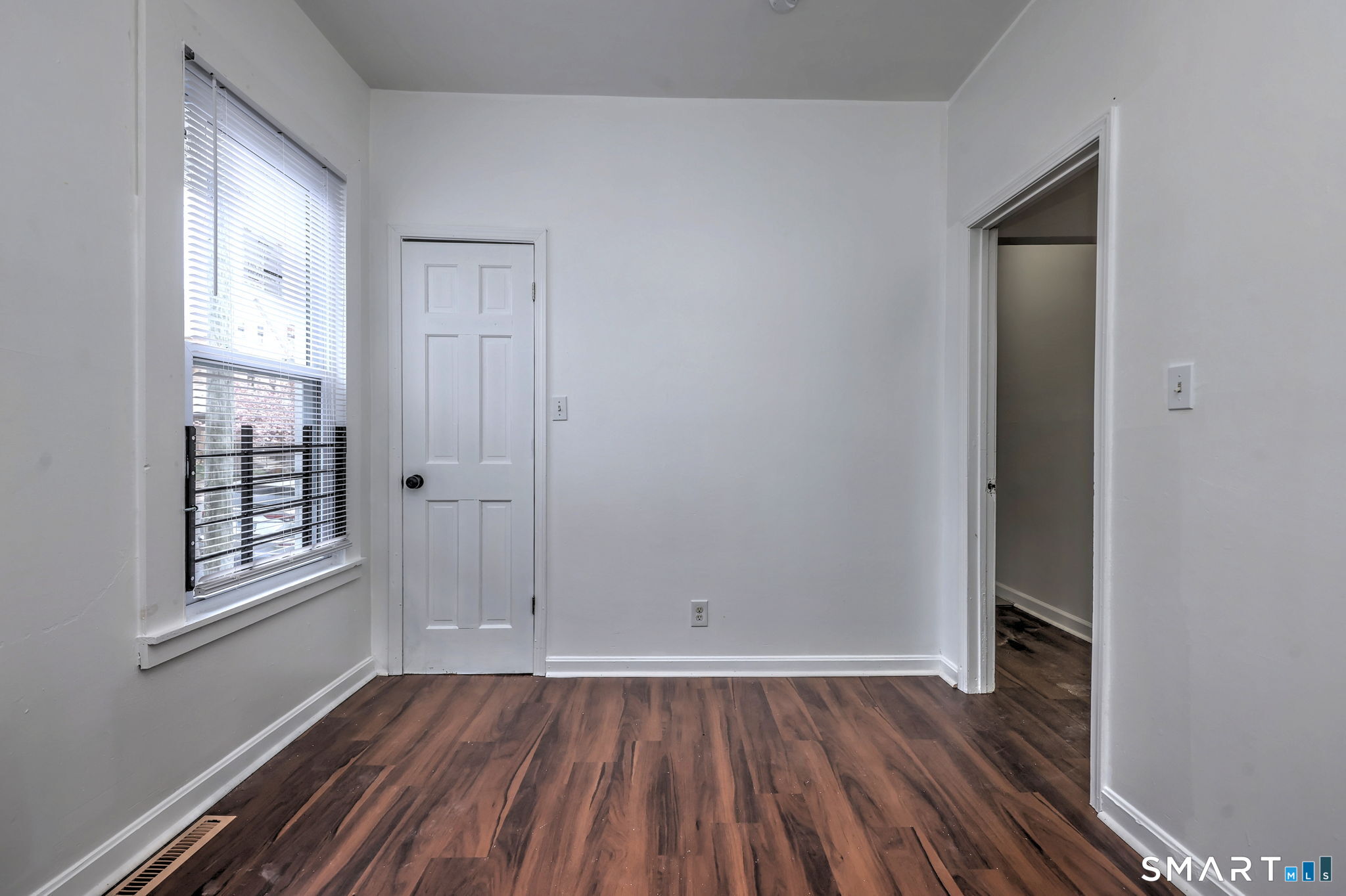 483 Ferry Street, Unit 1 New Haven, CT 06513 - Photo 25 of 33 an empty room with wooden floor and windows