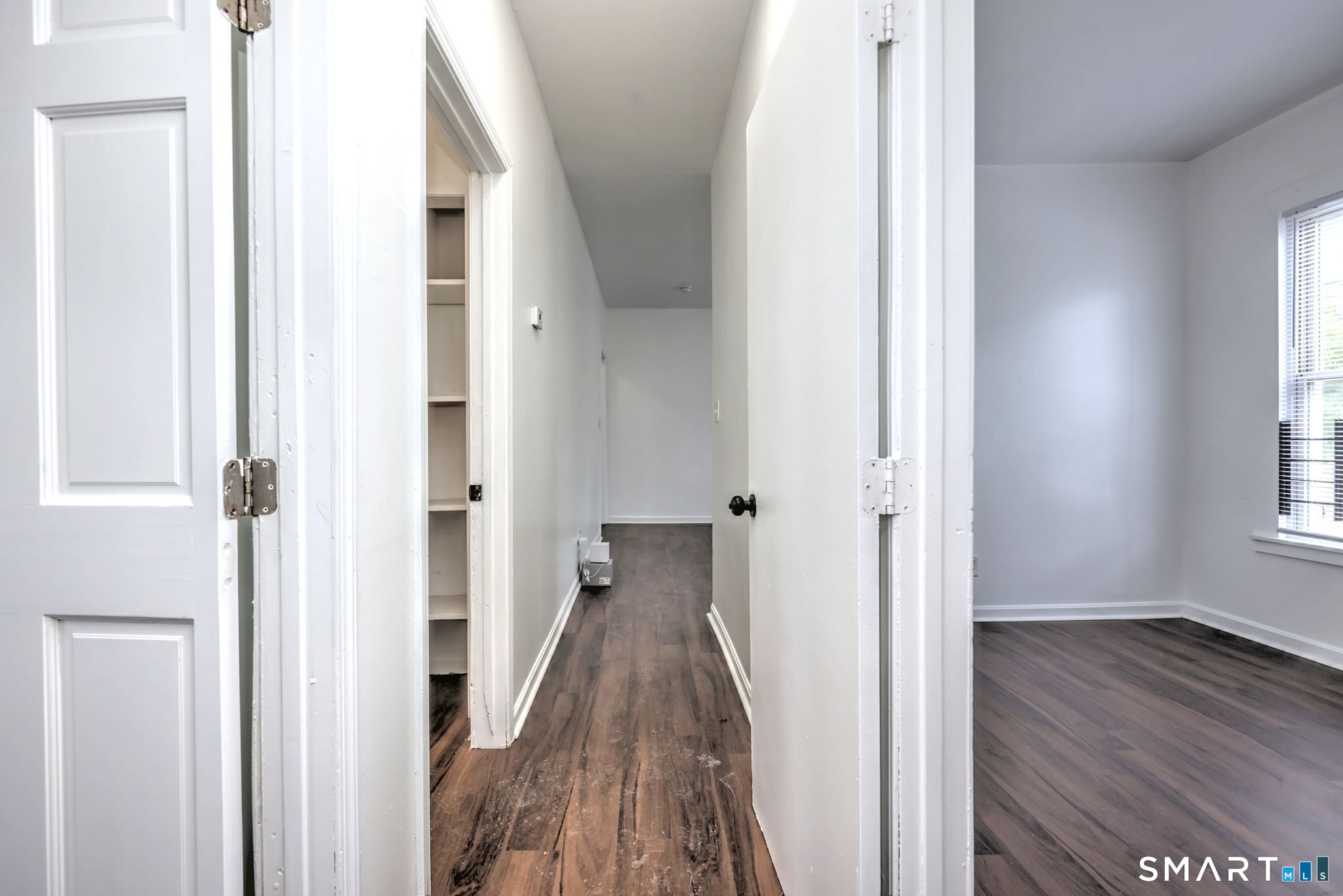 483 Ferry Street, Unit 1 New Haven, CT 06513 - Photo 27 of 33 a view of a hallway with wooden floor and staircase
