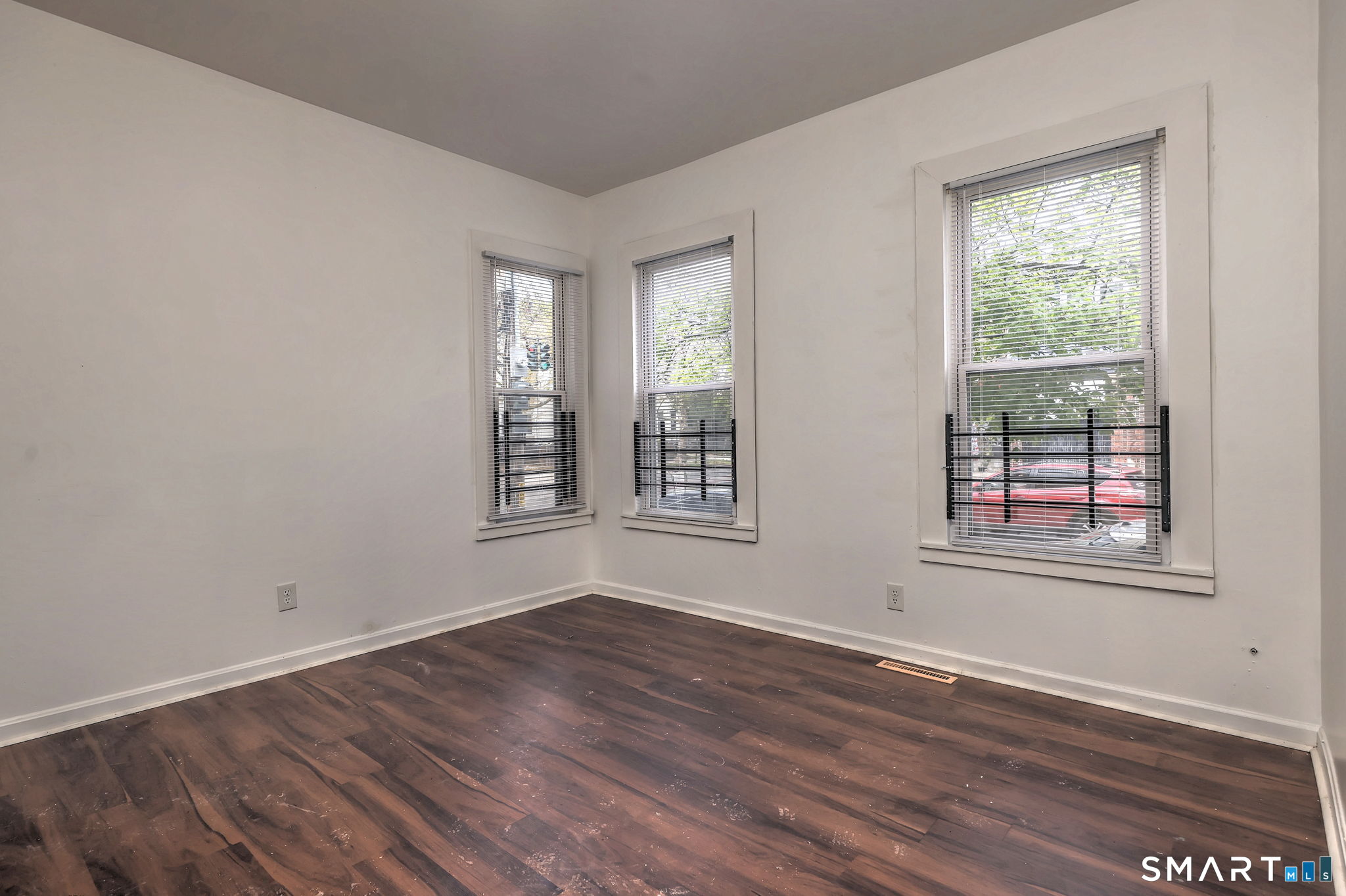 483 Ferry Street, Unit 1 New Haven, CT 06513 - Photo 28 of 33 a view of an empty room with wooden floor and a window