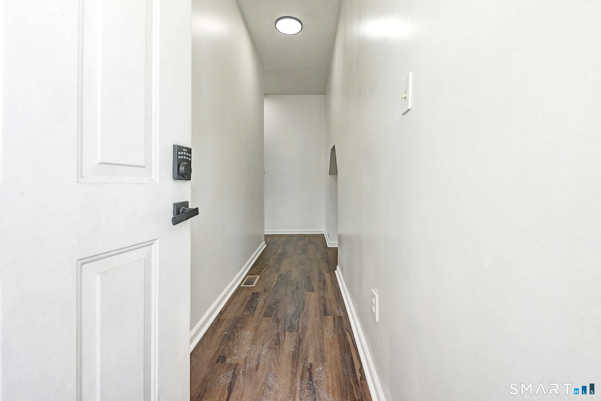 483 Ferry Street, Unit 1 New Haven, CT 06513 - Photo 3 of 33 a view of a hallway with wooden floor