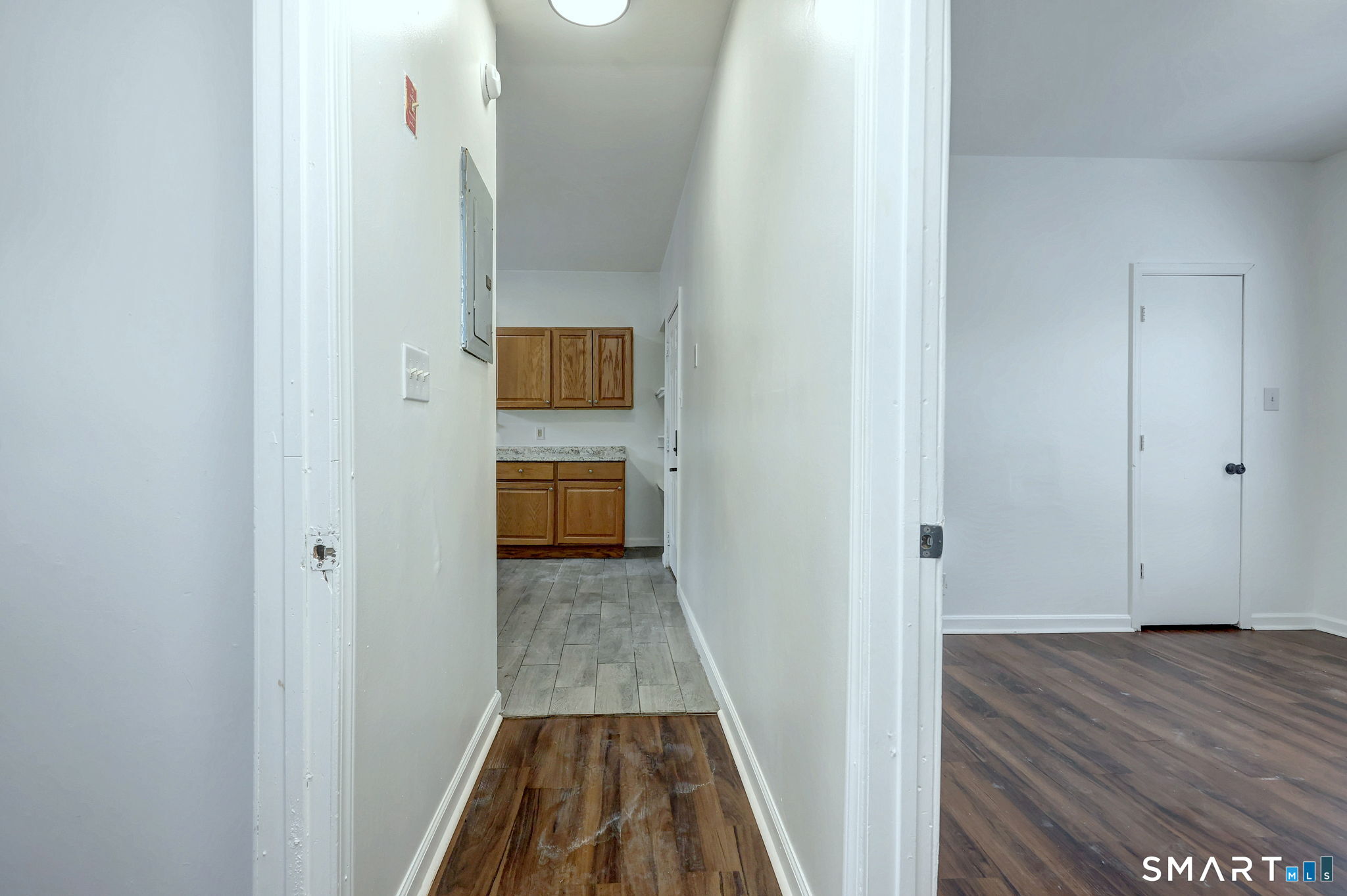 483 Ferry Street, Unit 1 New Haven, CT 06513 - Photo 31 of 33 a view of a hallway with wooden floor and a bathroom