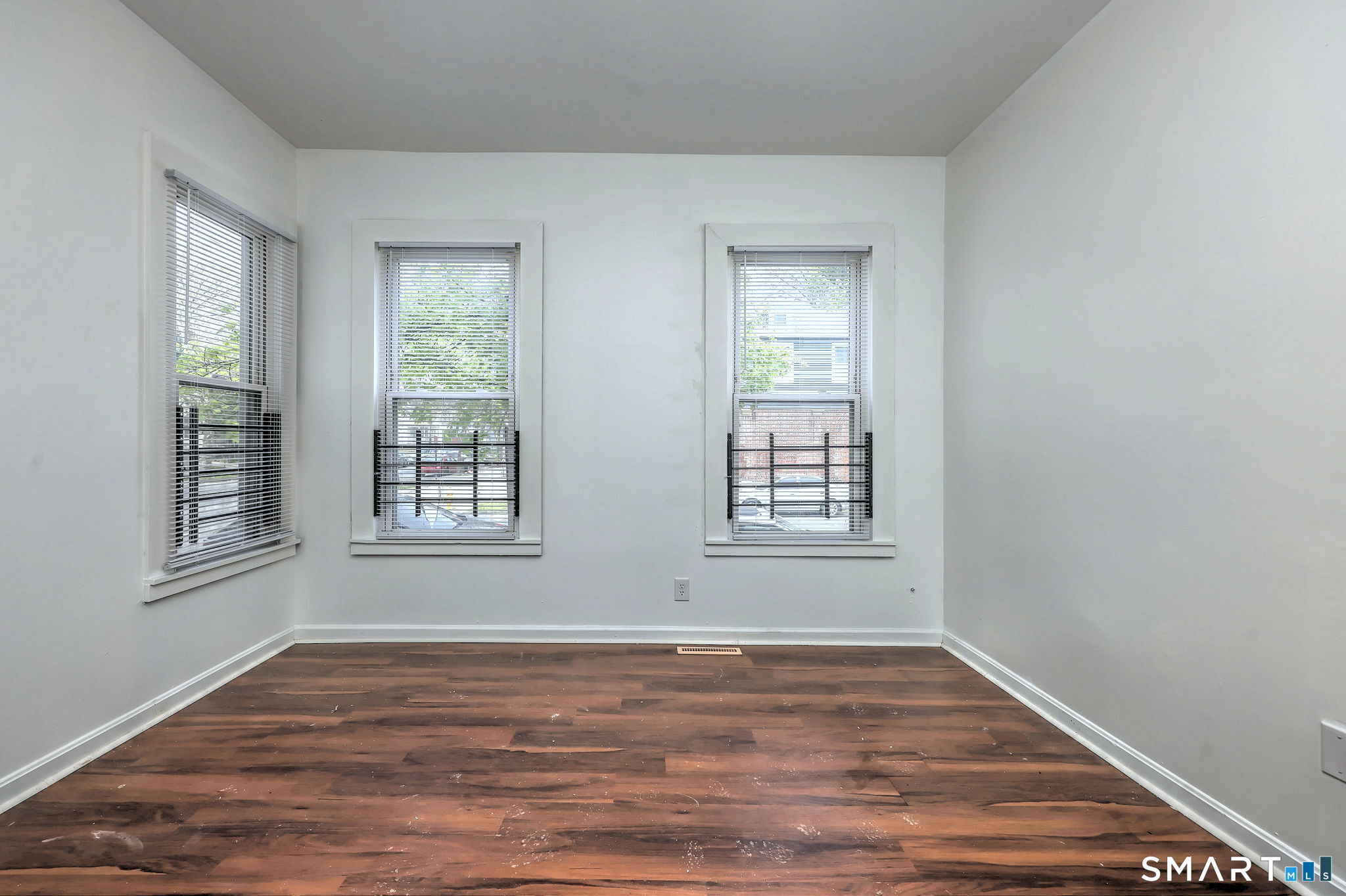 483 Ferry Street, Unit 1 New Haven, CT 06513 - Photo 32 of 33 a view of an empty room with wooden floor and a window