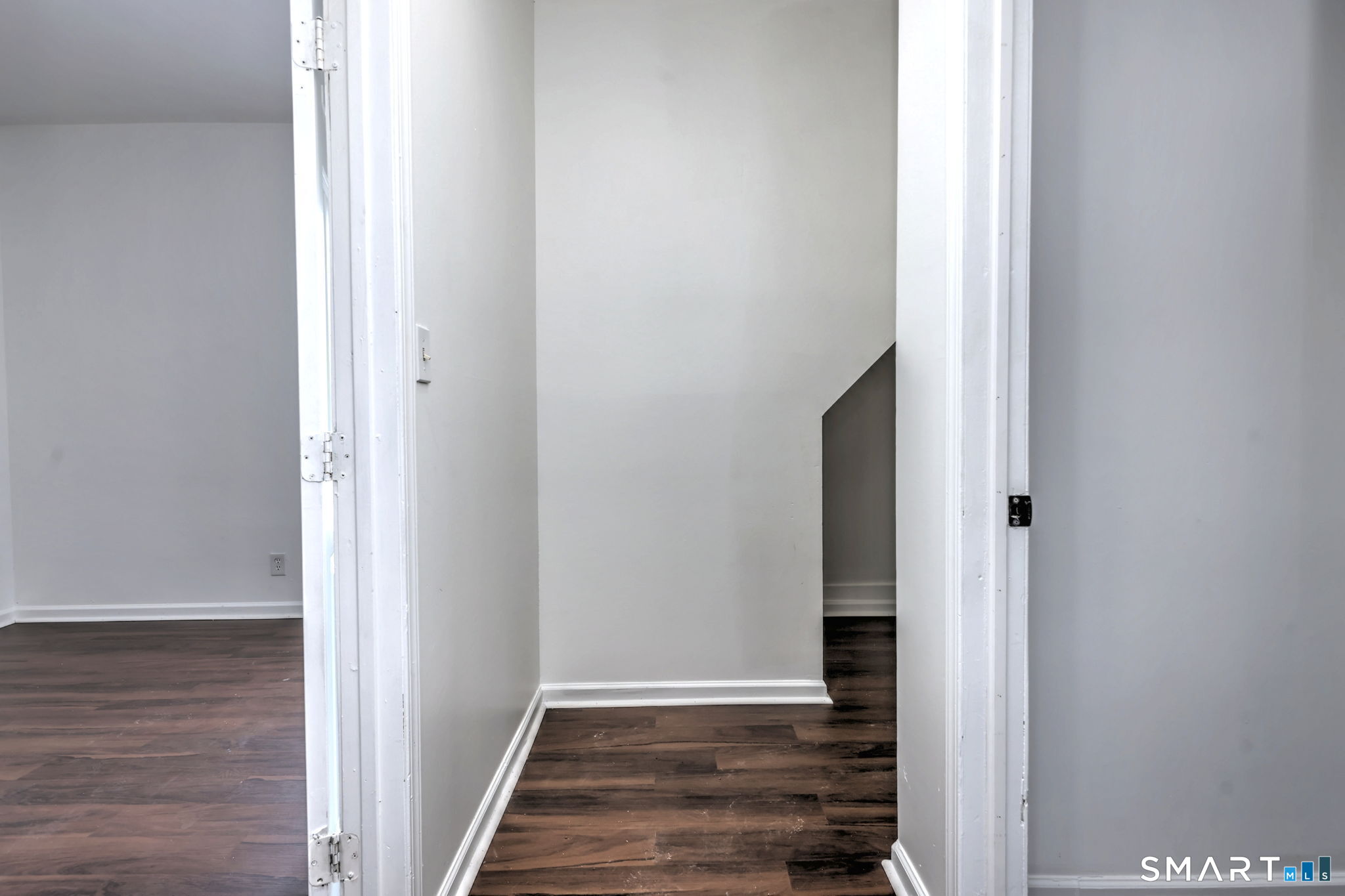 483 Ferry Street, Unit 1 New Haven, CT 06513 - Photo 4 of 33 a view of a hallway with wooden floor and staircase