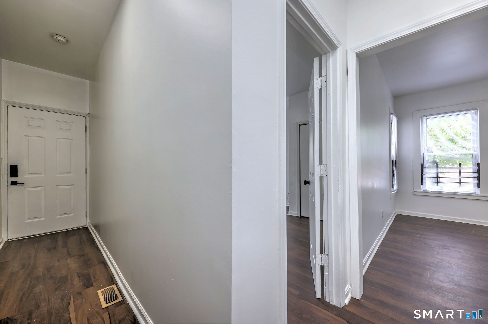 483 Ferry Street, Unit 1 New Haven, CT 06513 - Photo 5 of 33 a view of a hallway with wooden floor and a bathroom
