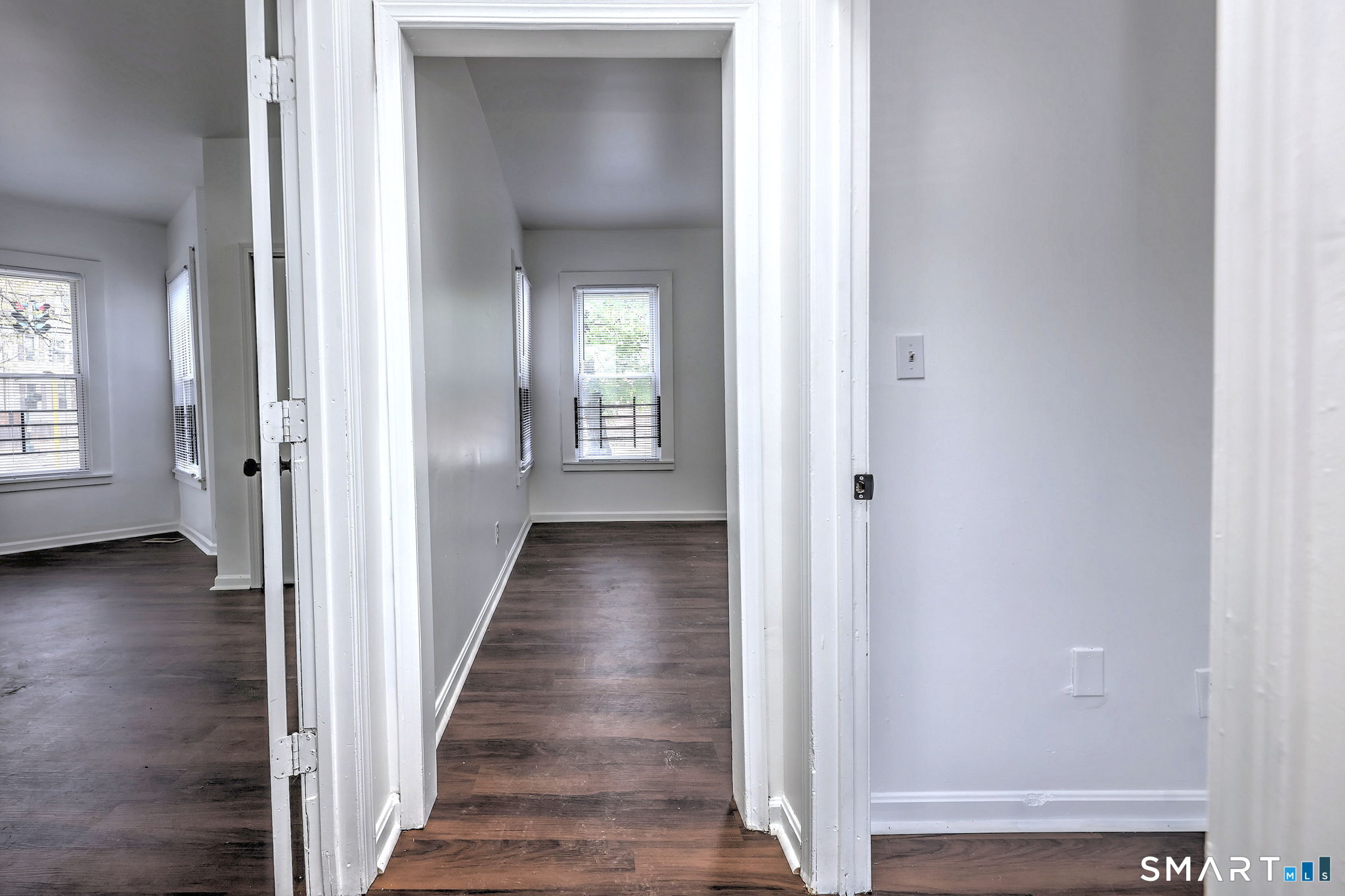 483 Ferry Street, Unit 1 New Haven, CT 06513 - Photo 6 of 33 a view of a hallway with wooden floor and closet